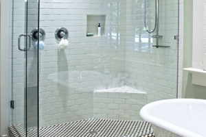 Turn your shower into a spa retreat with sprayers, a rain showerhead, and a bench.